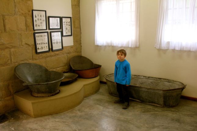 Joah wasn't sure what to make of these old baths (displayed in the loo foyer at the JP Nel Museum)...
