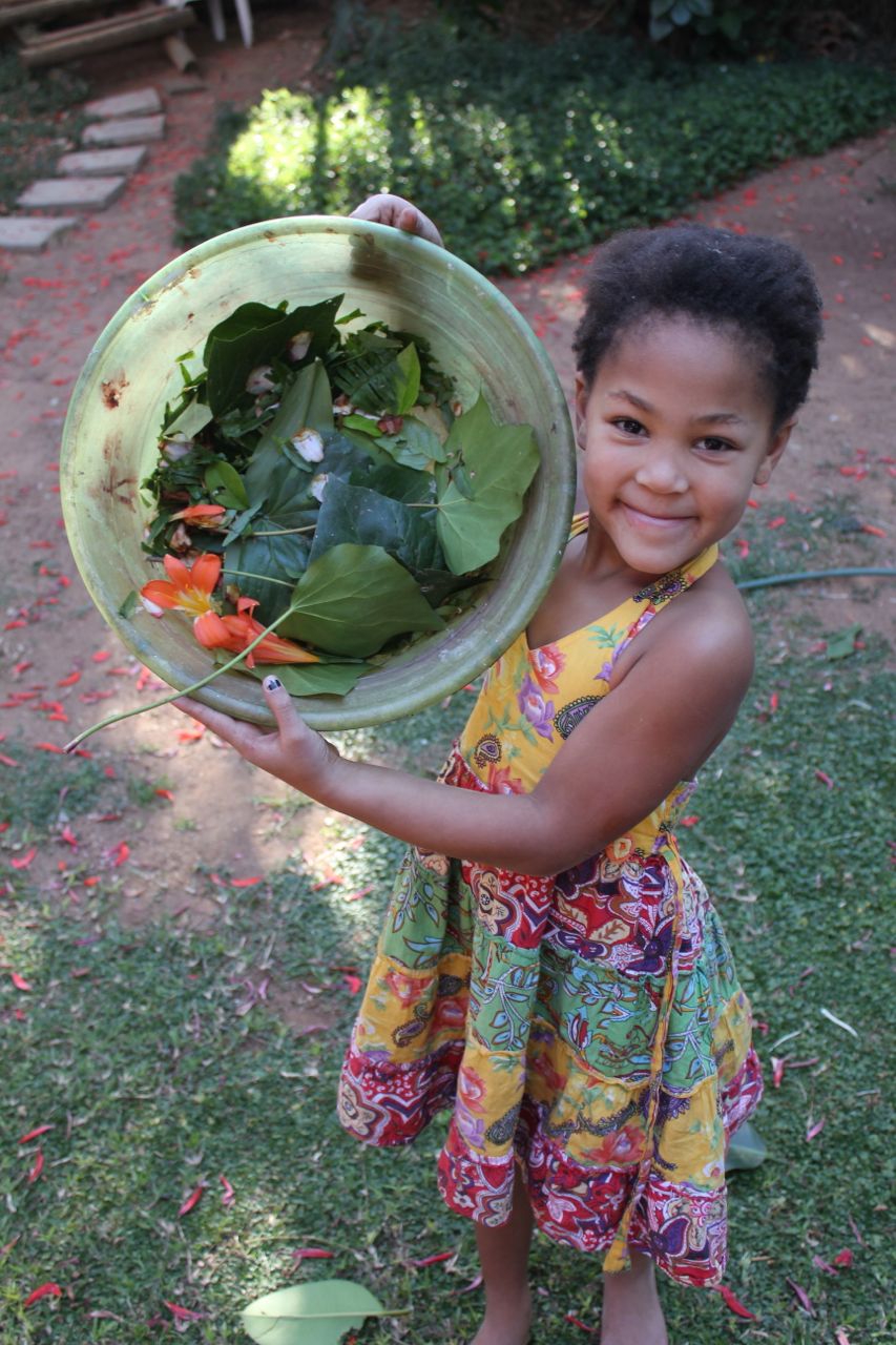 This is Zahra - Morgan and Joah's friend from next door with the "salad" that the 3 of them made (they invented a game around this salad which kept them busy for hours)...