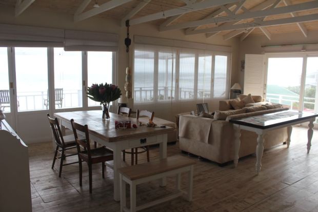 The lounge / dining area… with windows leading out on to the deck… all with uninterrupted views of the sea.